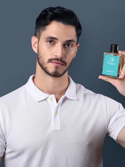 A direct, friendly shot of a model presenting a perfume bottle, perfect for e-commerce and social media.