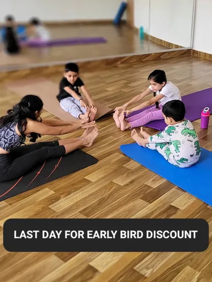A class of little yogis practicing Paschimottanasana, or Seated Forward Fold. This is a great opportunity to get an early bird discount on my kids' classes.