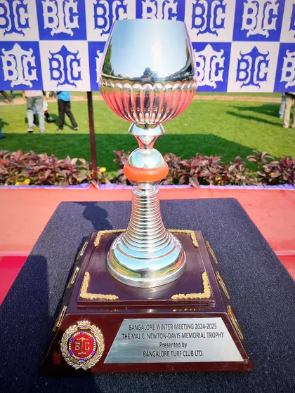 The Maj. C. Newton-Davis Memorial Trophy, a classic silver cup with a timeless design.