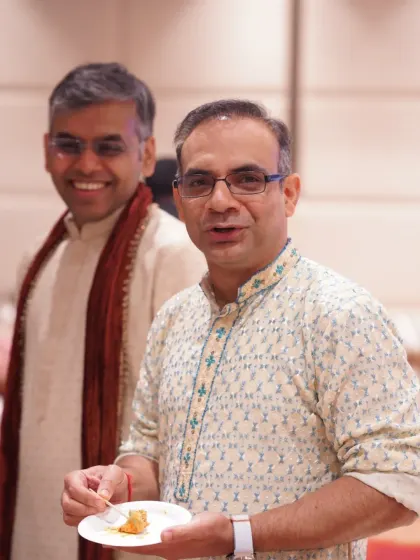 Two guests sharing a smile and a conversation. Capturing the joy of your friends and family is part of telling your complete wedding story.
