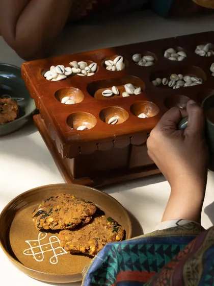 A moment of quiet ritual with pieces from the 'Kolam' collection. The patterns, drawn with rice flour in my childhood, are here captured permanently in clay, a tribute to home and memory.