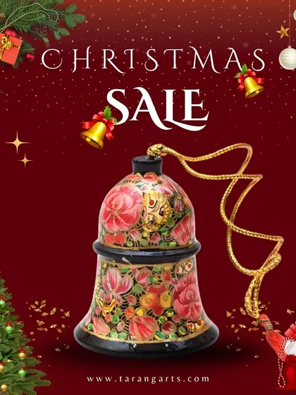 A close-up of a handcrafted Kashmiri papier-mâché hanging bell, showcasing the intricate floral patterns and vibrant colors that define this beautiful art form.