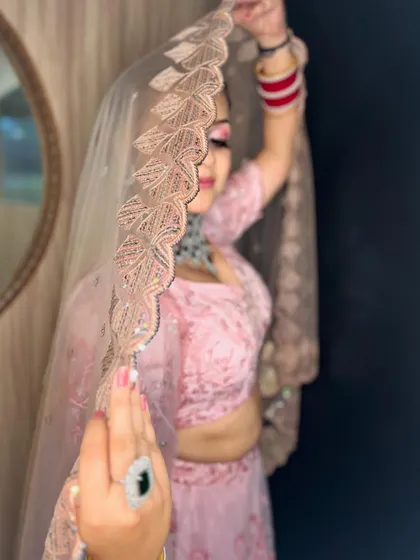The veil shot adds a dreamy and romantic quality to this contemporary bridal look.