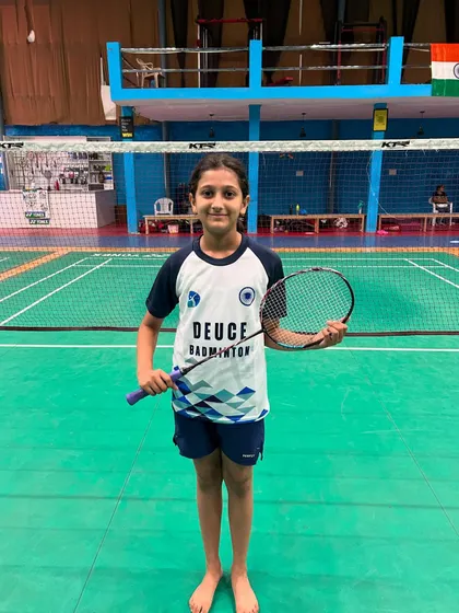A young U11 girls' player, ready to represent Deuce Badminton Academy at the state level.