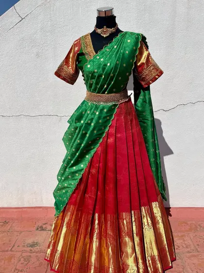 A red and green half saree, another timeless traditional combination.
