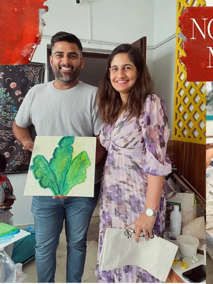 A happy couple with their finished textured leaf painting. It's a beautiful piece of art to hang in their home.