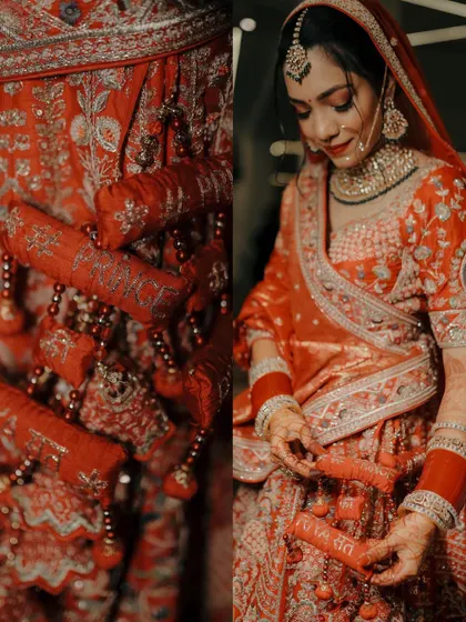 A detailed shot of the bride's lehenga, showing the custom embroidery of the groom's name on the latkans, a personal and unique touch.