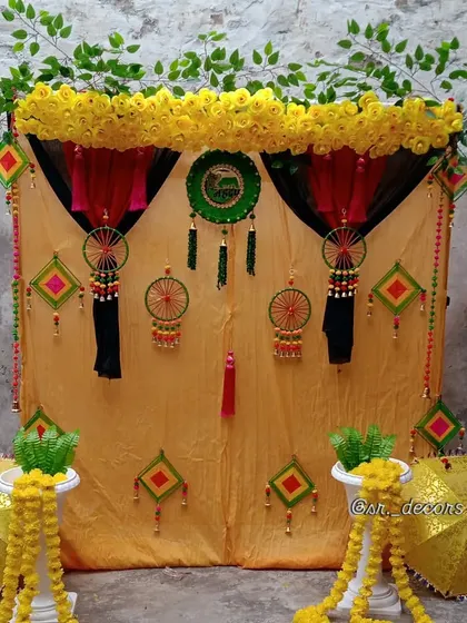 I create authentic and traditional Haldi setups right at your home. This decor uses a classic yellow marigold theme with gota patti hangings and decorative umbrellas for a truly desi function.