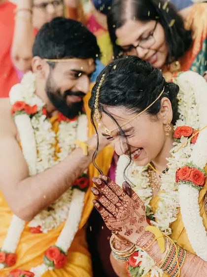 A beautiful candid moment from a traditional wedding ceremony, capturing the joy and emotion of the rituals.