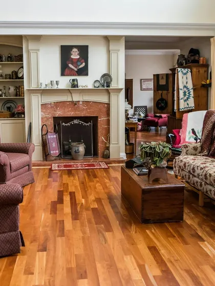 For this traditional living room, I selected a classic wood floor with natural grain variations. It provides a perfect, warm foundation for classic furniture and creates a cozy, lived-in atmosphere around the fireplace.