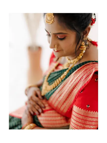 A soft and artistic portrait from a maternity photoshoot. The makeup is kept natural and glowing to complement the serene and emotional theme of the shoot.