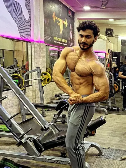 A powerful most muscular pose in the gym.