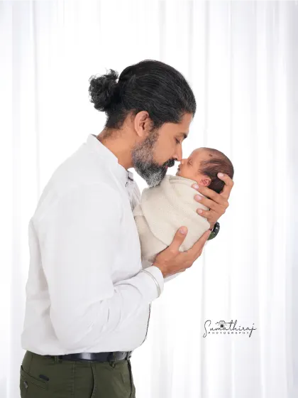 A father holding his newborn for the first time is a moment of quiet strength and tenderness. I aim to capture that powerful emotion in a simple, clean portrait that you will treasure forever.