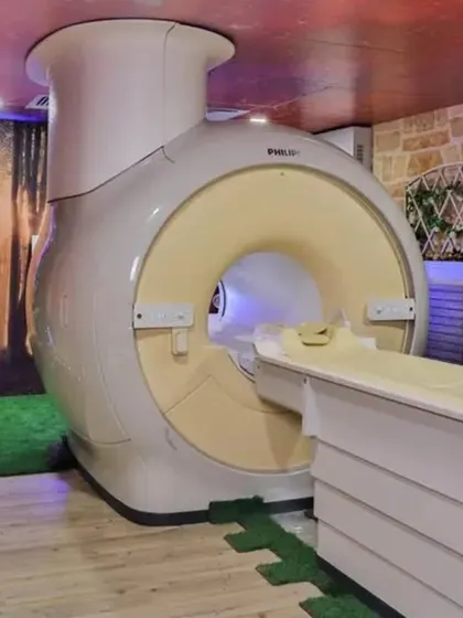 To reduce patient anxiety, I transformed this MRI room with calming nature-themed wallpapers. The stone wall texture, greenery, and forest mural create a peaceful environment, making the medical experience more comfortable.