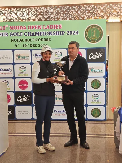 Shrestha Shukla is awarded the winner's trophy for the Open Category at the 10th Noida Open Ladies Amateurs, a significant victory in her career.