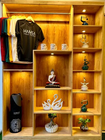 A beautifully organized shelf displaying our studio's merchandise and decor. The small details contribute to the serene and inspiring atmosphere we cultivate.