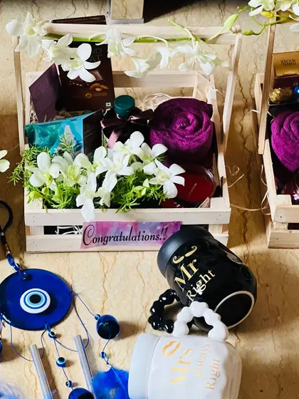 This image shows the complete corporate wedding gift set, including the mugs and the filled crate.