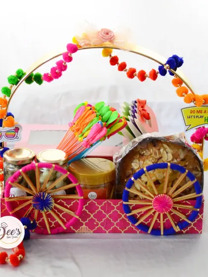 A look at our grand Holi hamper, designed to look like a festive cart. It's packed with our special chocolate gujiya, a thandai tea cake, organic gulal, and other bestselling treats to make your celebration colorful and delicious.