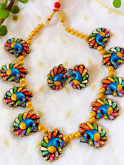 A multi-color peacock motif choker, a vibrant and playful piece.
