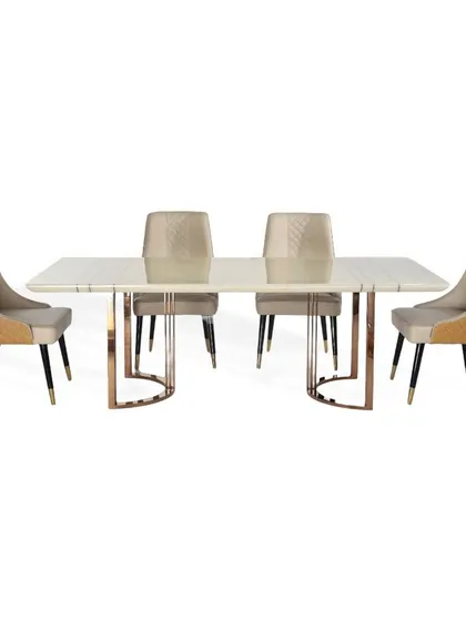 A full view of the 4-seater dining set with a white marble top and rose gold PVD base. The chairs feature a unique dual-texture design with smooth and quilted leatherette.