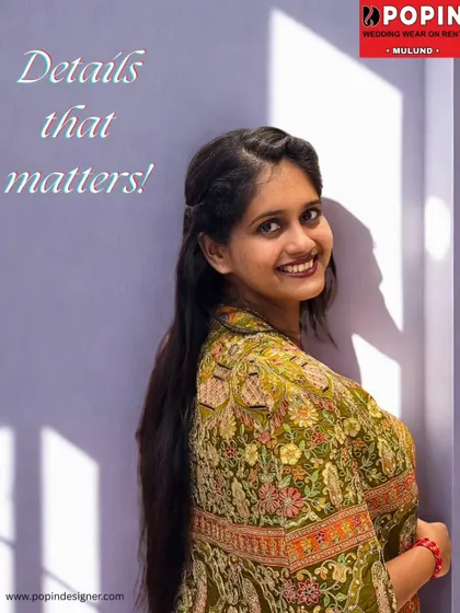 "Details that matter". This close-up shot highlights the beautiful smile of the model and the fine details of the ethnic plazo set's fabric.