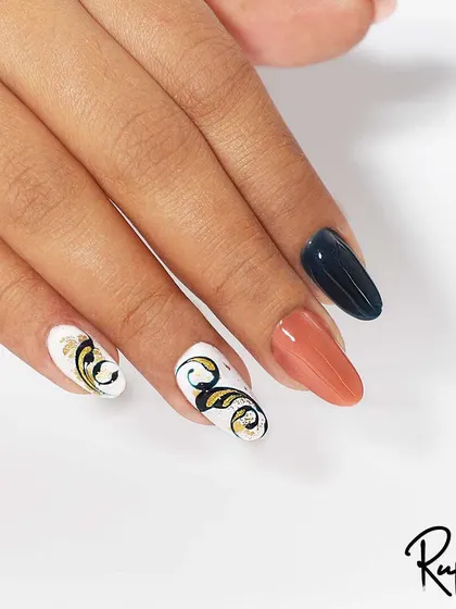 Another angle of the swirl art extensions, showing how the design flows across the nails.