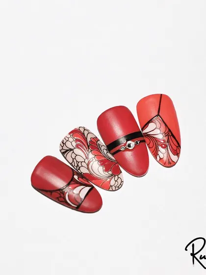 A collection of stamping art designs. The red and white floral patterns on an ombre base are particularly striking.