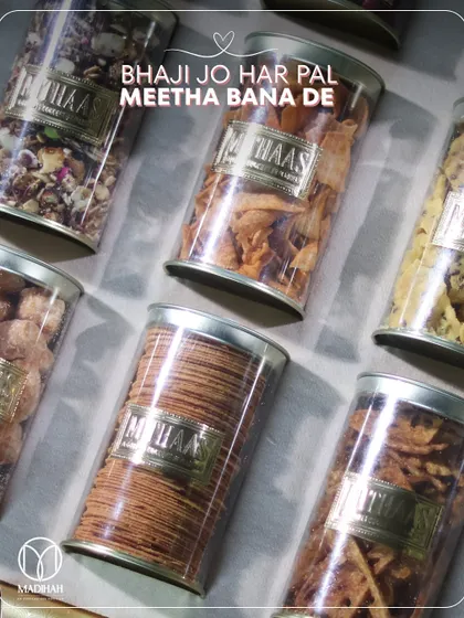Bhaji jo har pal meetha bana de. A close-up of the assorted traditional snacks in my Bhaji boxes, each labeled with our 'Mithaas' branding, promising a memory of love with every bite.