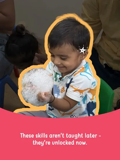 A moment of pure sensory delight! This little one is exploring the texture of bubbles, an activity that stimulates the senses, encourages curiosity, and helps build new neural pathways in the brain. These are the skills we unlock now.