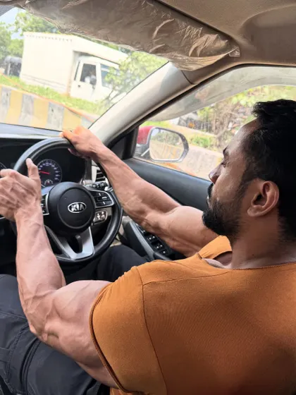 Volume up. Driving, but the arm vascularity is on full display.