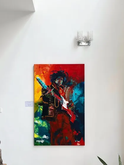 The Hendrix painting on display, a beacon of color and energy in the gallery space.