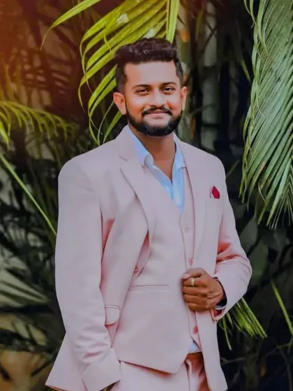 A portrait of our client in his dapper pink three-piece suit. This is a great example of the custom-stitched rental suits I offer.