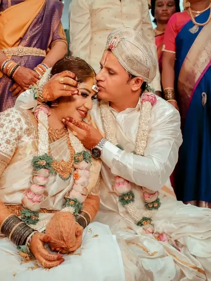 A beautiful candid moment from a wedding ceremony, filled with emotion and surrounded by family.