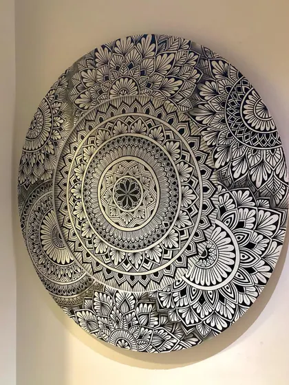The layered mandala without the backlight on, showcasing the clean black and white design and the depth created by the overlapping circles.