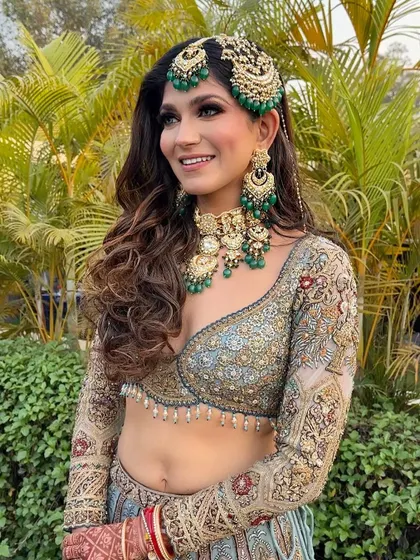 A close-up portrait where her smile truly shines. The makeup enhances her features beautifully for this picture-perfect moment.