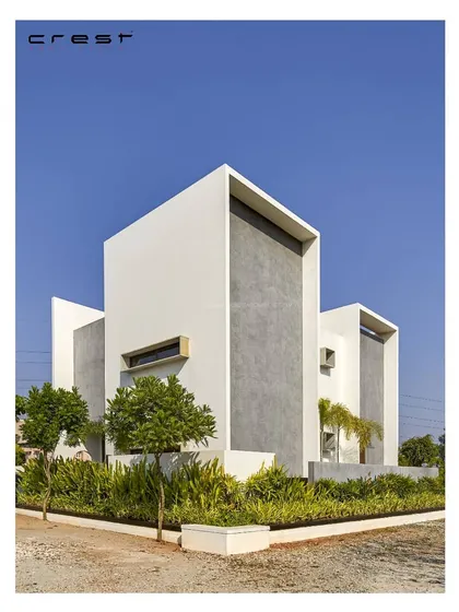 The 'Framed House' uses bold, intersecting white volumes to create deep-set openings and a powerful minimalist aesthetic. A textured grey panel adds a contrasting element.