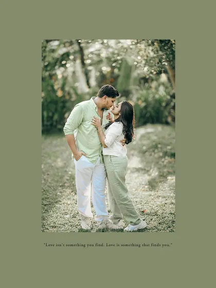 A sweet kiss in a garden setting, this pre-wedding photo is framed with a soft green border and a romantic quote.