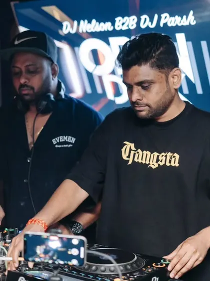 Side by side with DJ Nelson, both of us focused on delivering a seamless mix for the crowd.