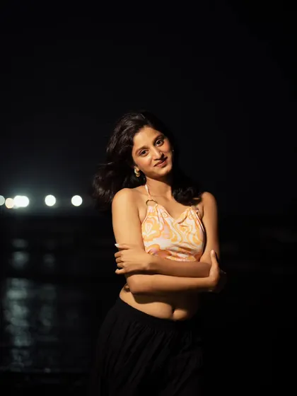 A smiling, happy shot that shows the versatility of night portraits. They don't always have to be serious; they can be joyful and full of life too.