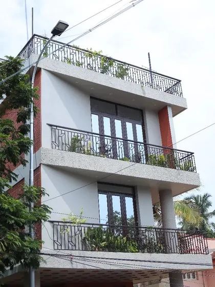 A view of the multi-level residence, showcasing how we design for vertical living on smaller plots while ensuring each floor has access to light, air, and outdoor balcony space.