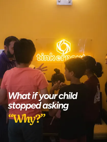 We often start our sessions by asking big questions to get students thinking. Here, a group of kids are gathered under our neon sign, ready to explore the world of making.