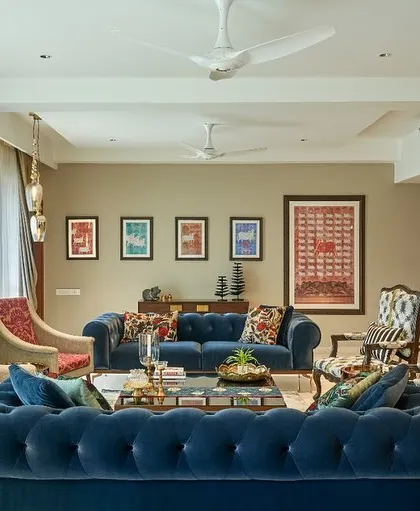 A wide view of a living room featuring my set of five Pichwai prints. The art serves as a central design element, tying together the room's modern and traditional accents.