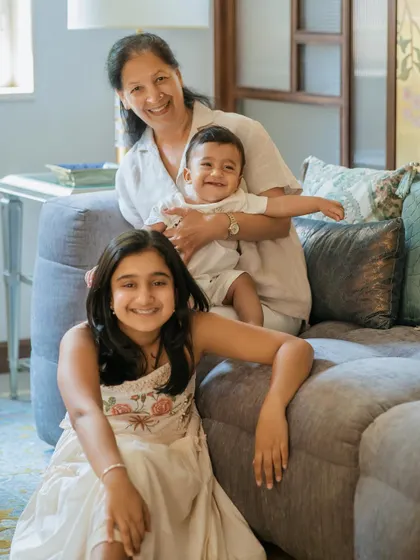 A multi-generational portrait filled with smiles. Having grandparents as part of the session at home adds another layer of warmth and history to your family's story.