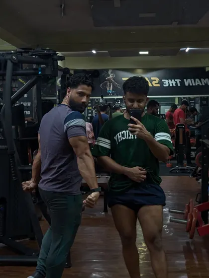A quick pose with a client after a tough session. We work hard, but we also celebrate the progress and the pump together. That shared energy is what makes the gym a community.