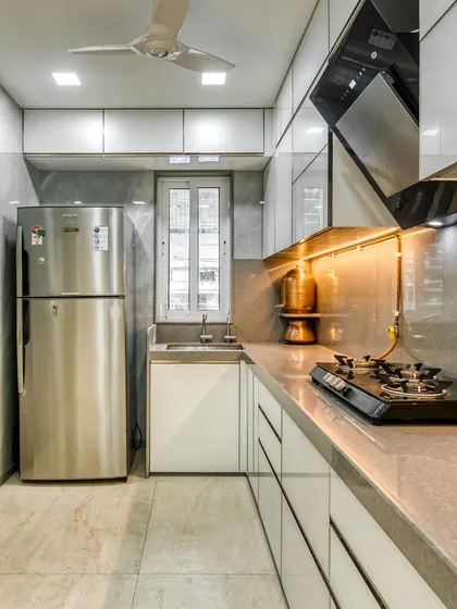 We create modern kitchens that look great and work efficiently, tailored to your needs. This image showcases a compact yet stylish design, perfect for urban living.