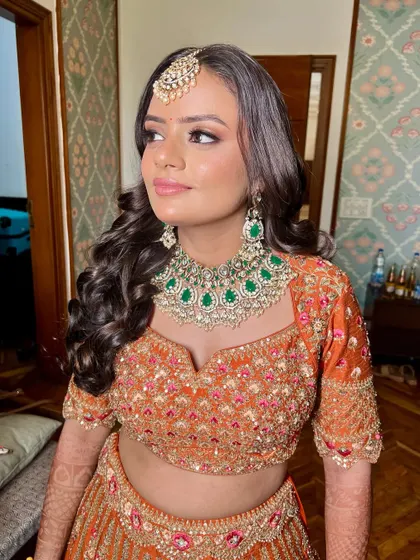 A candid and beautiful shot of the bride, her makeup looking flawless and radiant.
