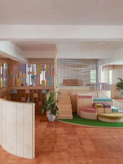 The combination of learning shelves and our indoor play structure shows our commitment to developing the whole child: mind and body.