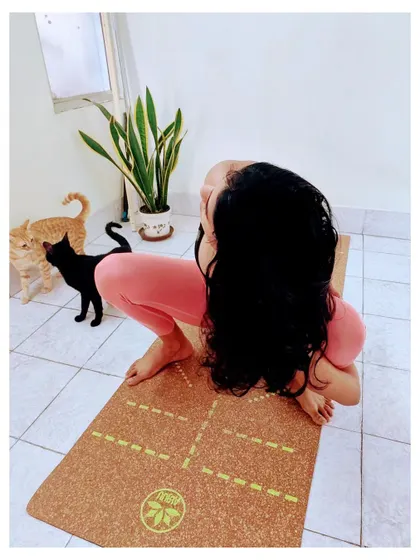 Here I am in Malasana, or Garland Pose, on my favorite cork yoga mat. I explain why I love using sustainable and eco-friendly mats that are comfortable, stable, and have great grip.