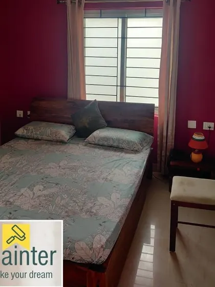 A bedroom with a rich magenta accent wall, adding a bold and energetic pop of color to the space.