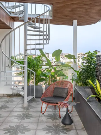 We designed the terrace of the Avani Residence as a tranquil escape, complete with a spiral staircase and lush planters. It's a space crafted for both quiet introspection and lively entertainment, showcasing our ability to blend architecture with nature.